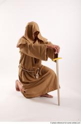 JOEL_ADAMSON MONK KNEELING POSE WITH SWORD